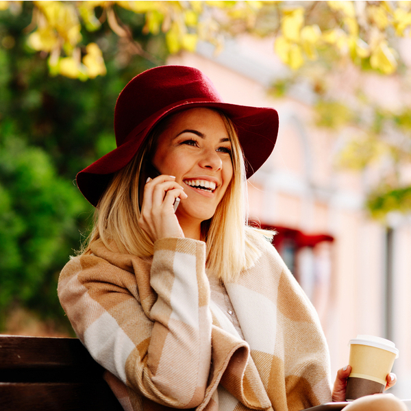 Young Woman on a Phone Outdoors