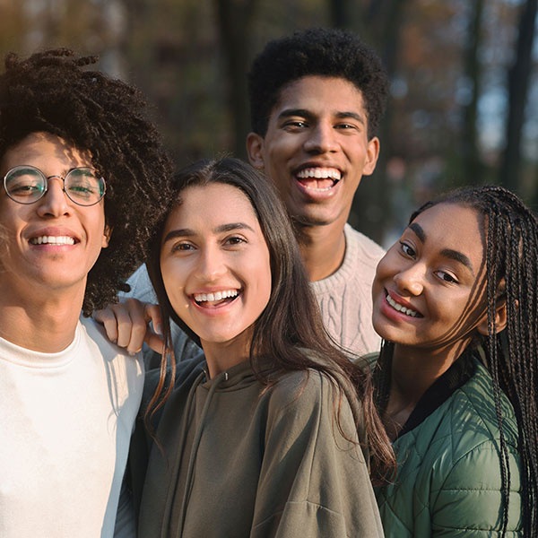 Group of Young Adults Outdoors Near a Park