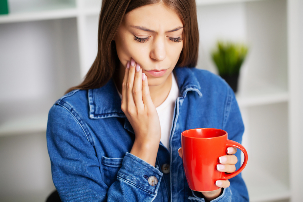 woman with wisdom tooth pain